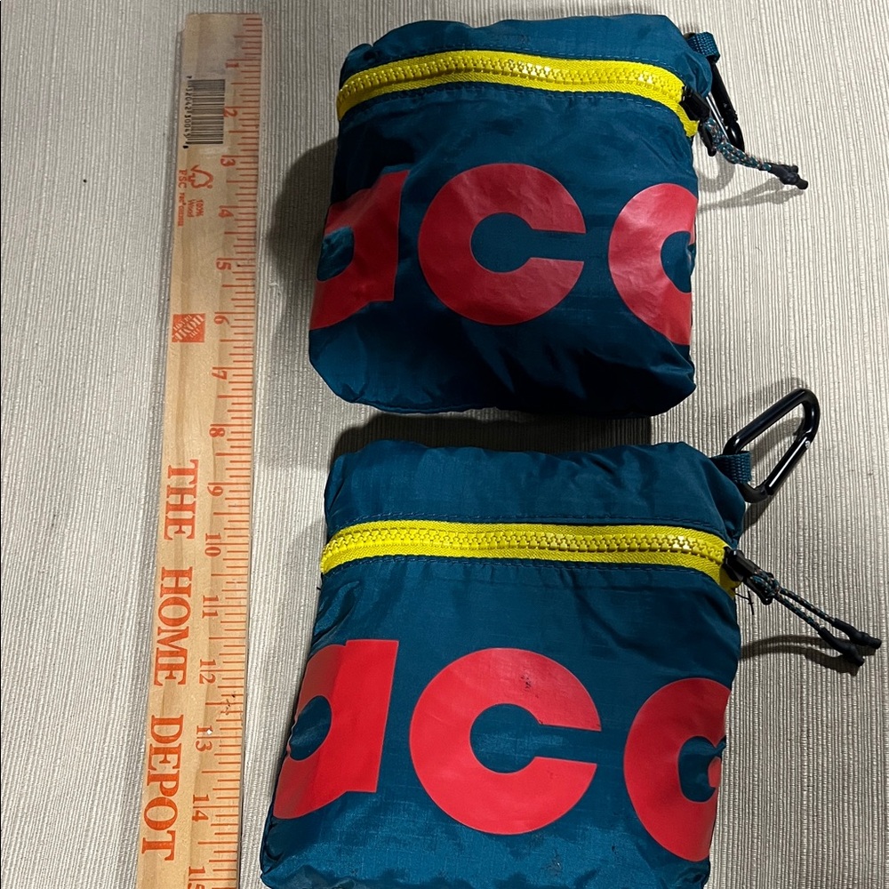 NIKE ACG PACKABLE DUFFLE BAG
 Red Pouch with Yellow Zipper